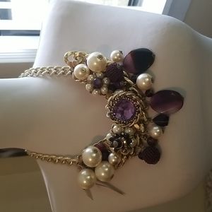 Statement necklace purple gemstone with large pearls.